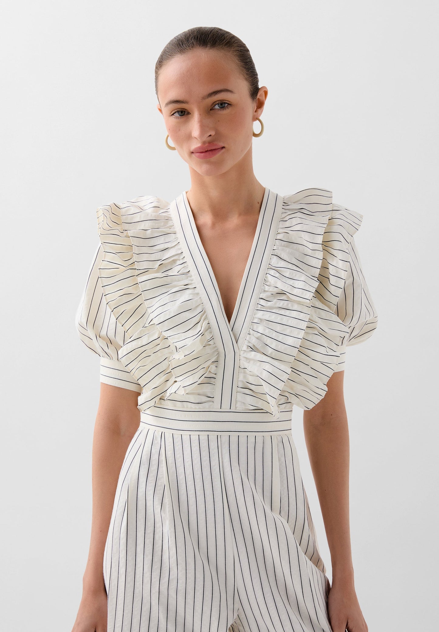 STRIPED JUMPSUIT WITH RUFFLES
