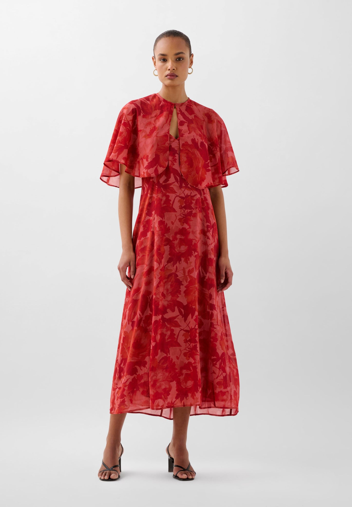 FLOWING PRINTED DRESS WITH CAPE