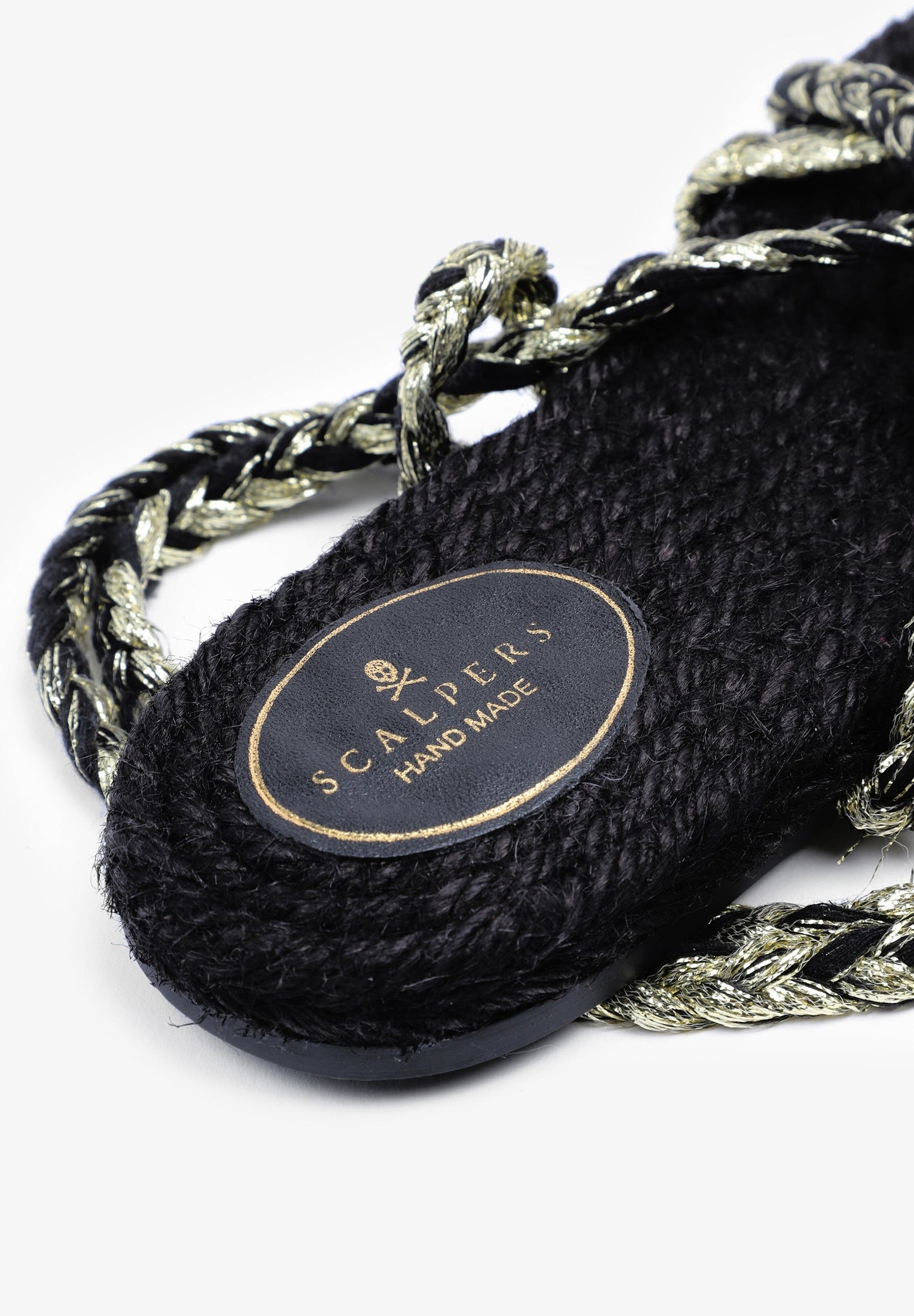 FLAT SANDALS TIED WITH BRAIDED CORDS