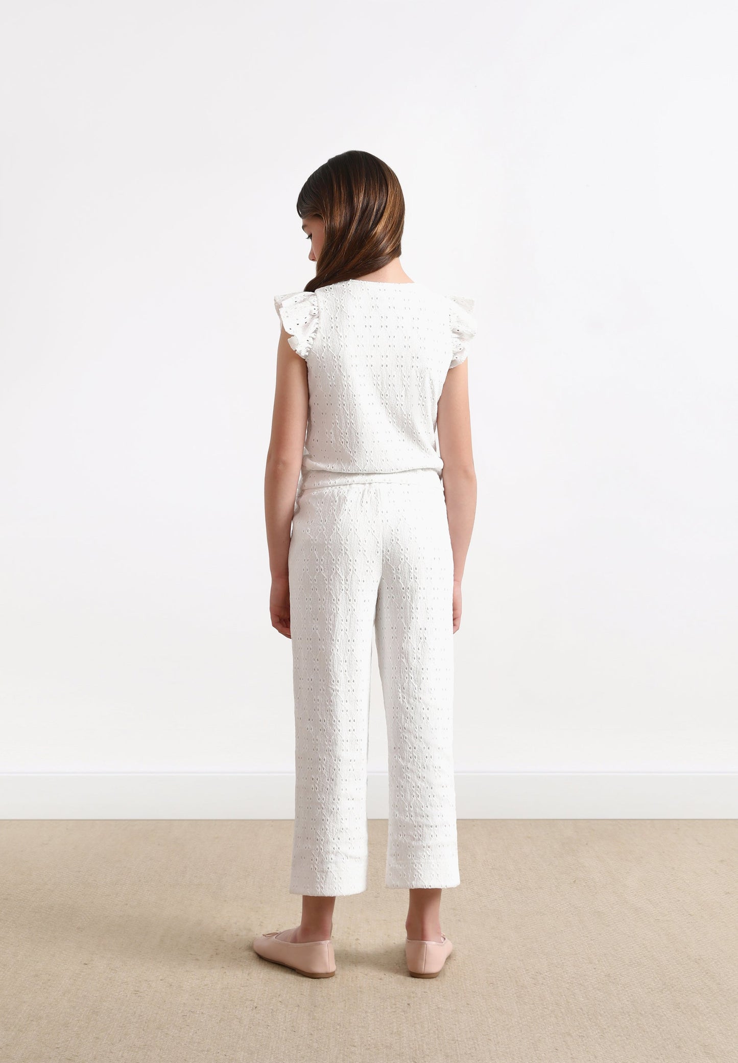 RUFFLED TOP WITH OPENWORK DETAILS