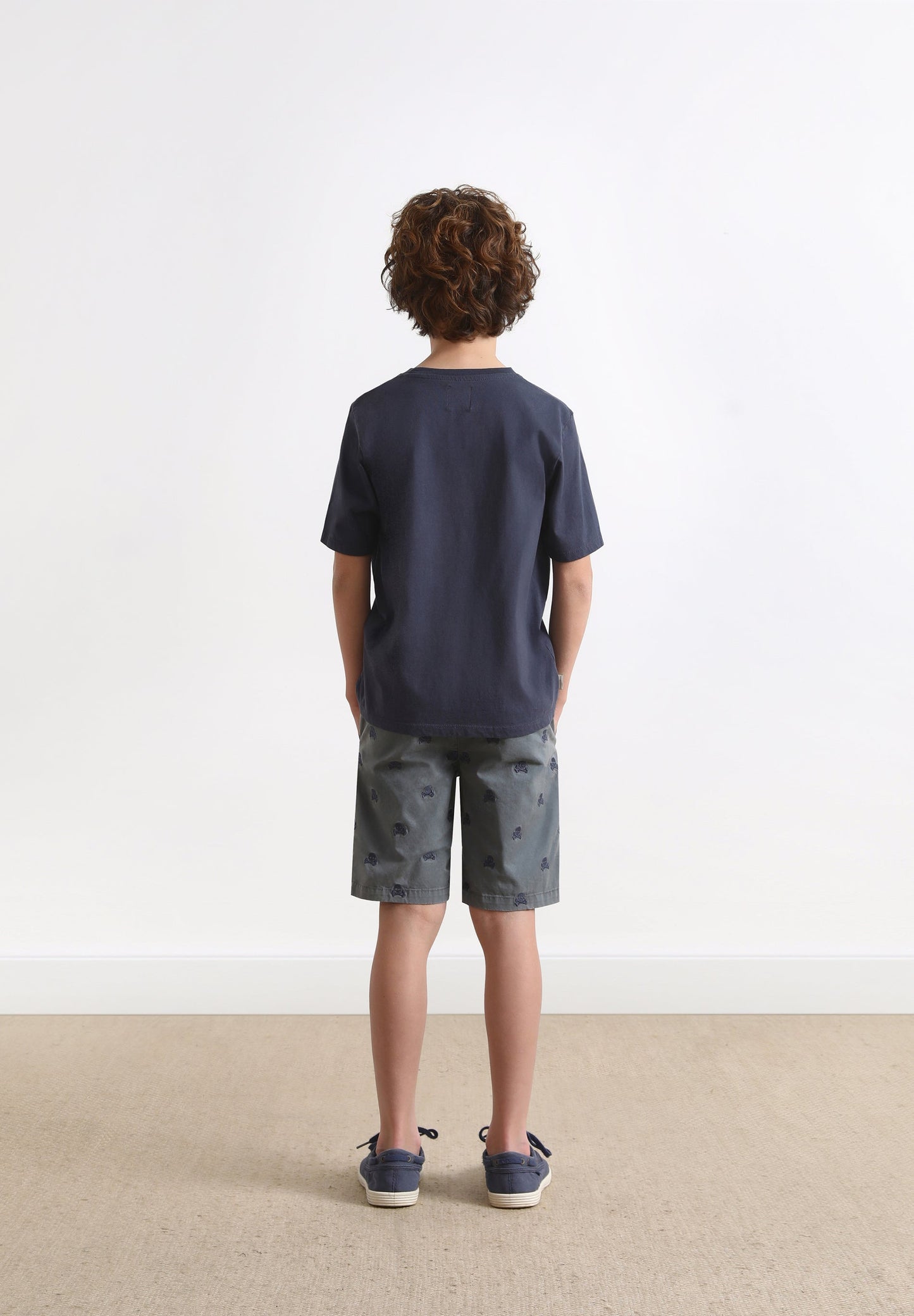 BERMUDA SHORTS WITH ALL-OVER SKULL PRINT