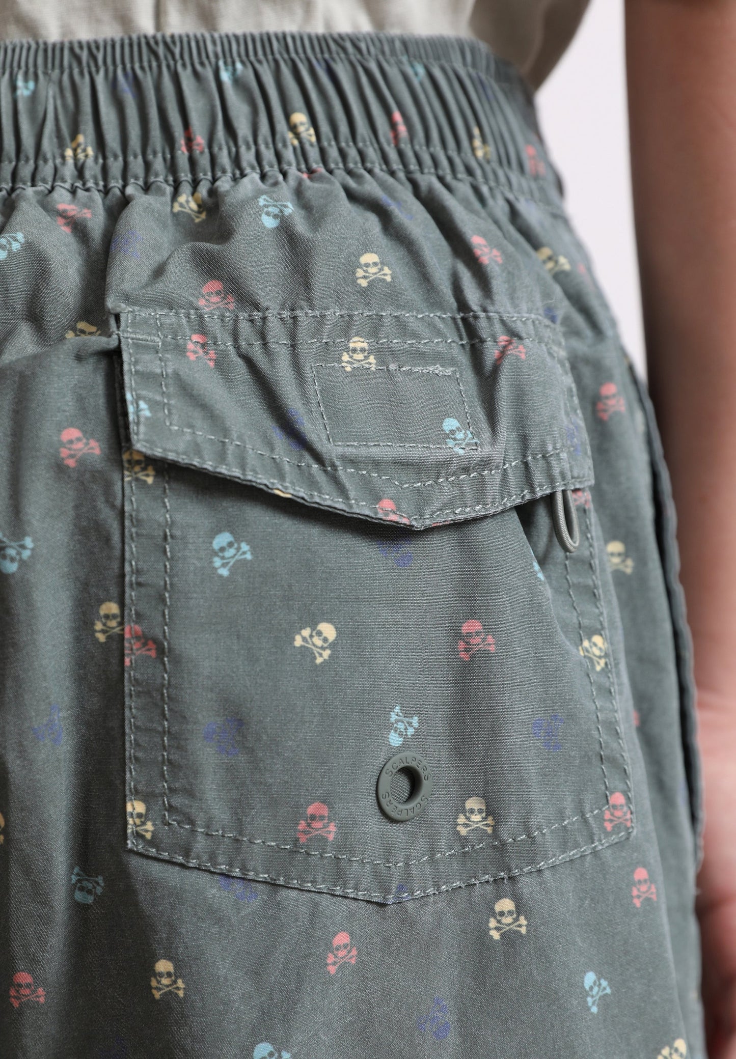 SWIMMING TRUNKS WITH ALL-OVER SKULLS