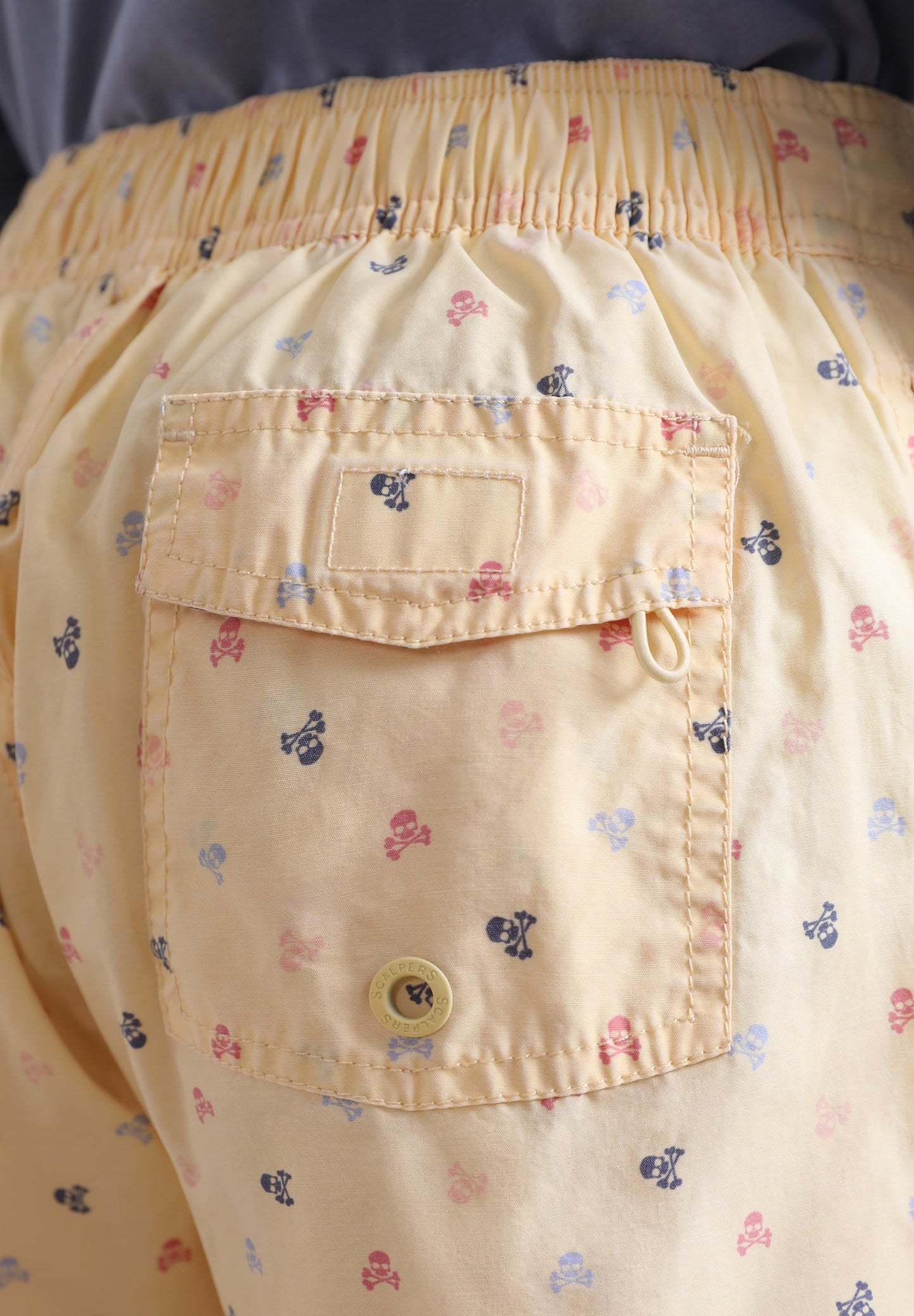 SWIMMING TRUNKS WITH ALL-OVER SKULLS