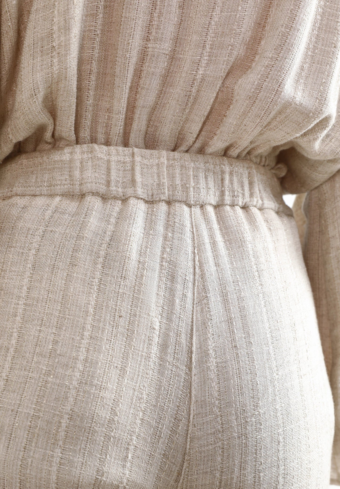 TROUSERS WITH METALLIC DETAILS