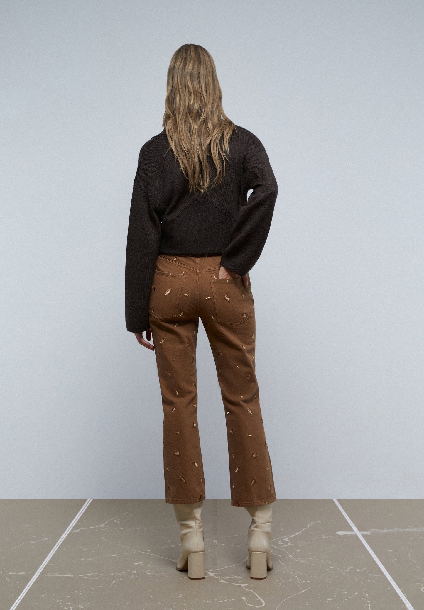 FLARED JEANS WITH EMBROIDERED DETAILS