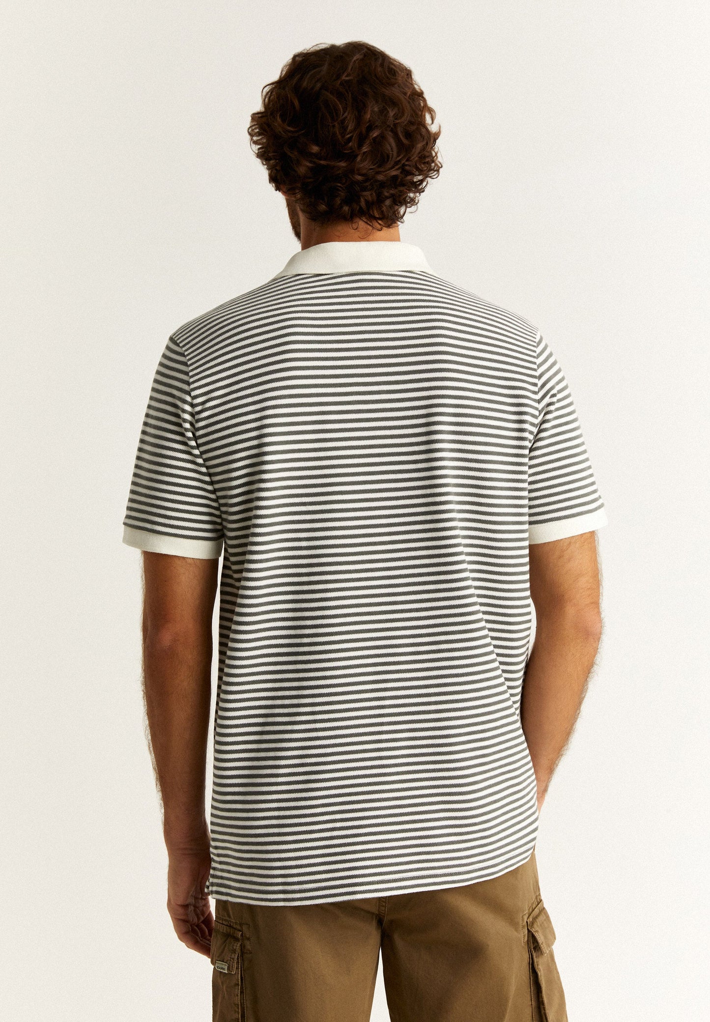 STRIPED POLO SHIRT WITH CONTRAST SKULL