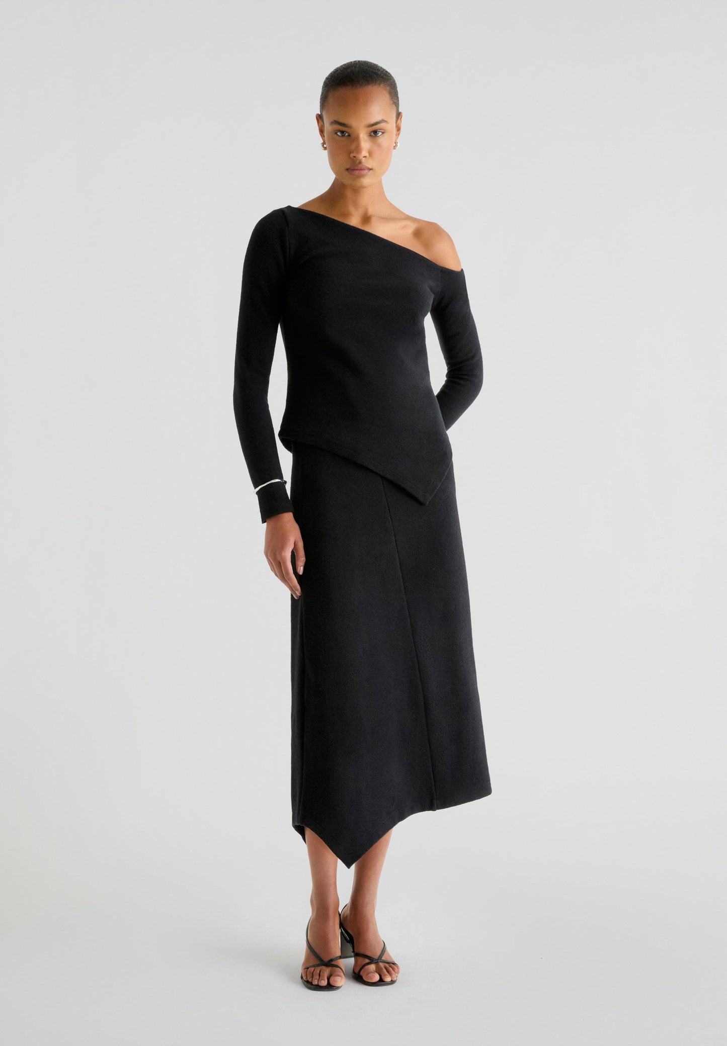 ASYMMETRIC KNIT MIDI SKIRT