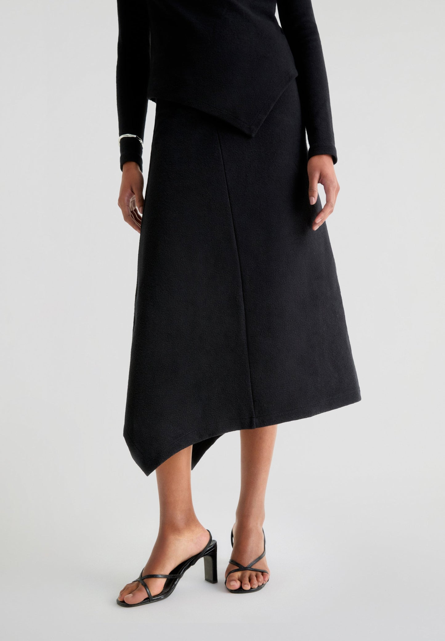 ASYMMETRIC KNIT MIDI SKIRT