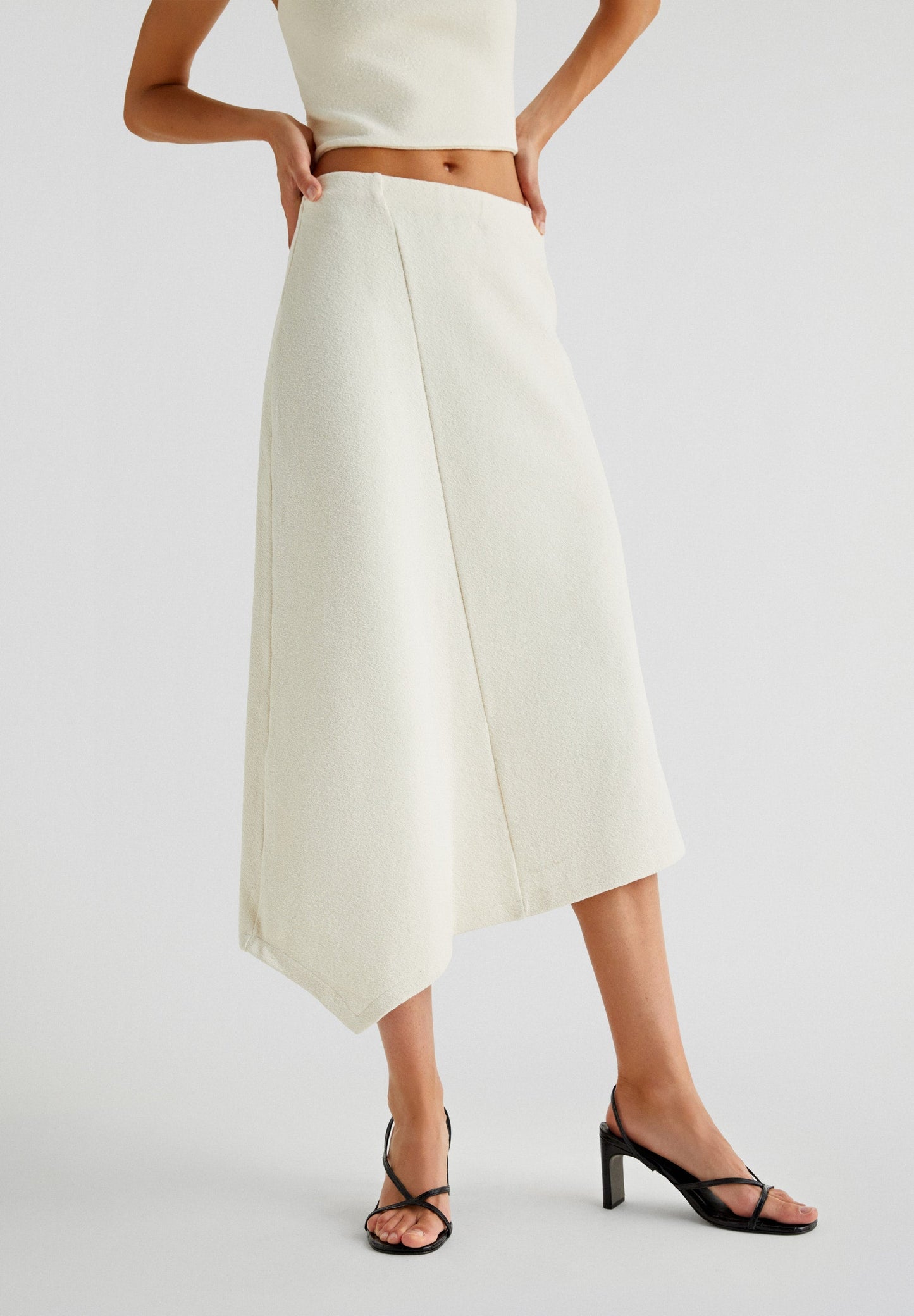 ASYMMETRIC KNIT MIDI SKIRT