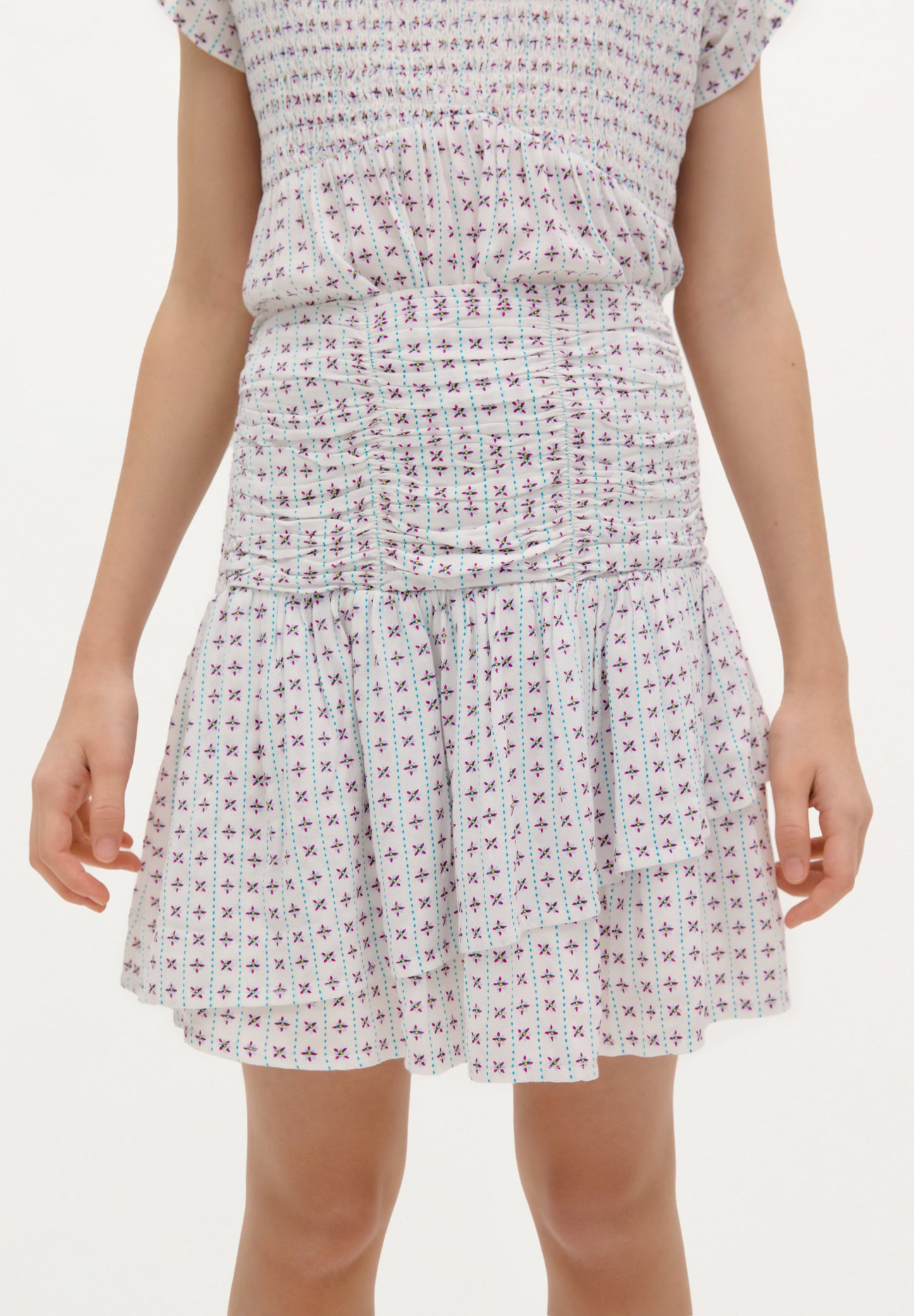 SMOCKED ASYMMETRIC SKIRT