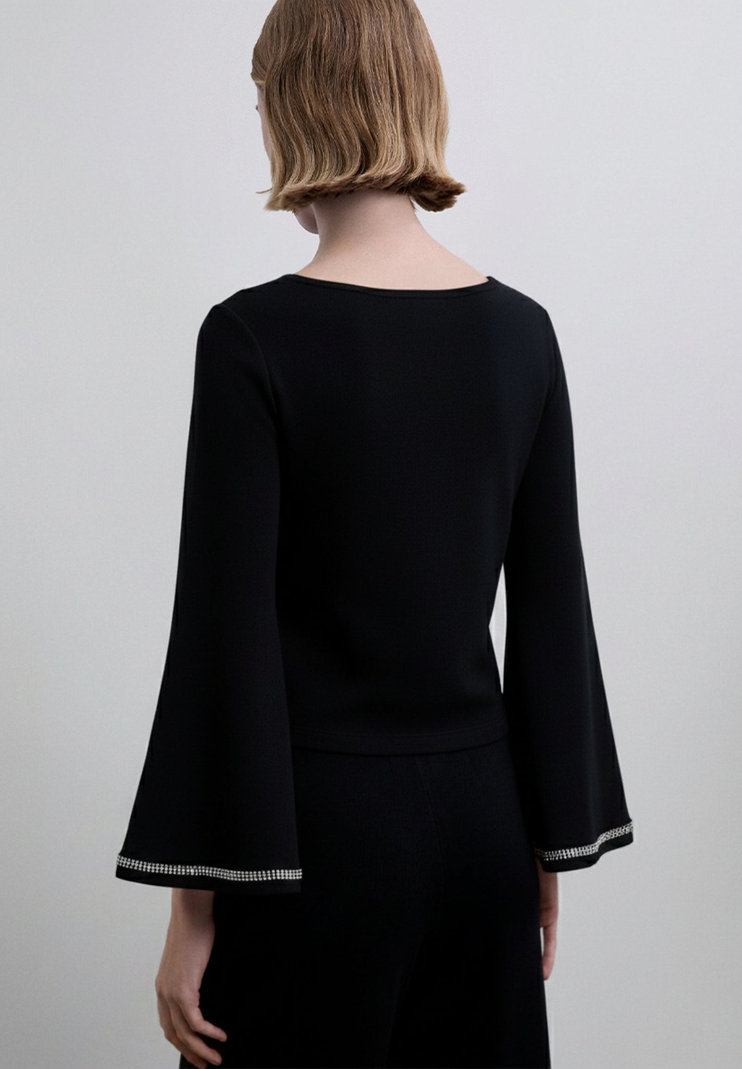 SWEATER WITH SEQUINNED DETAIL