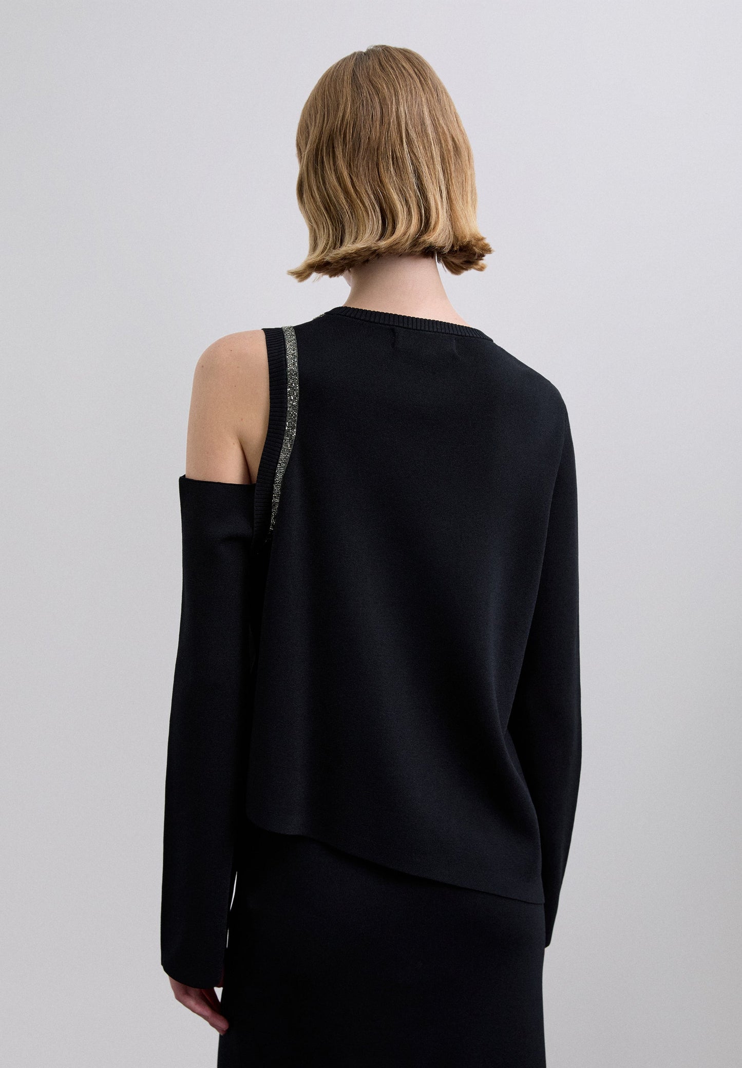 ASYMMETRIC SWEATER WITH STUDS