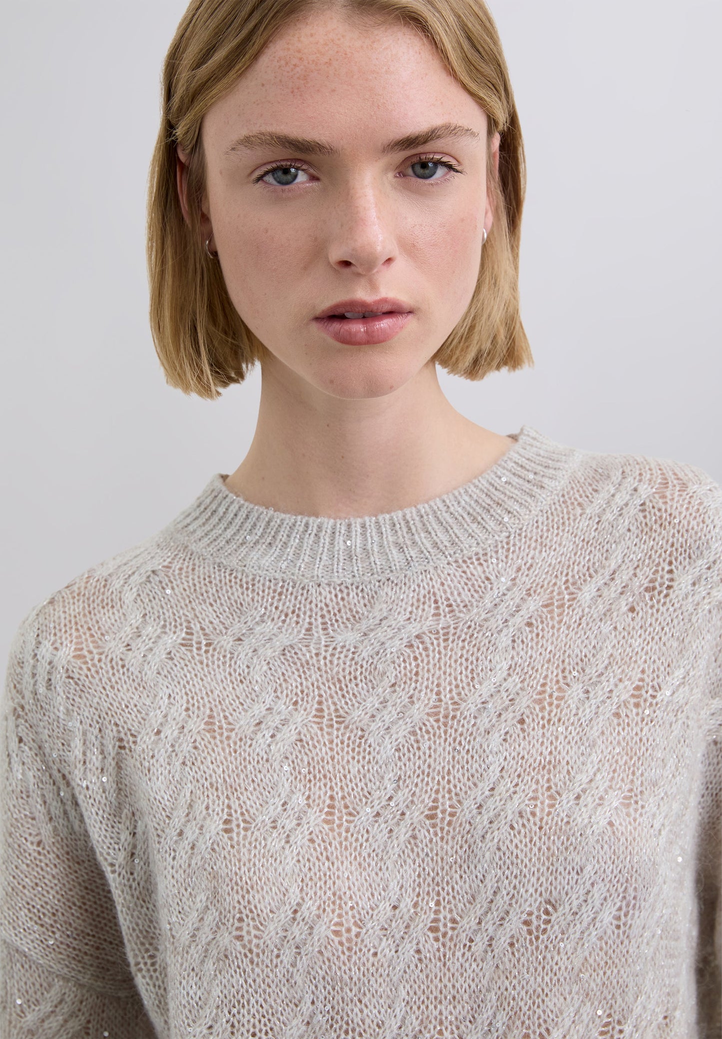 CABLE-KNIT SWEATER