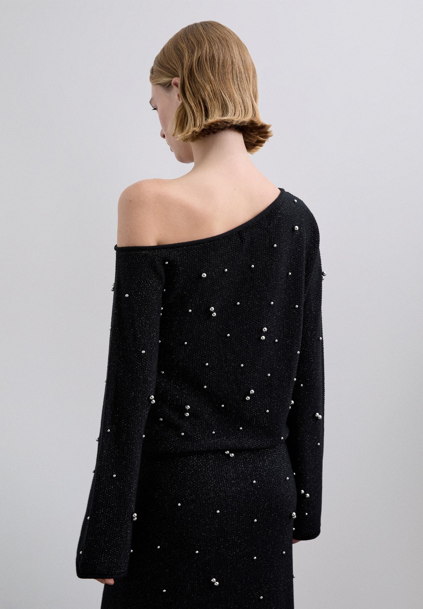 ASYMMETRIC SWEATER WITH PEARLS