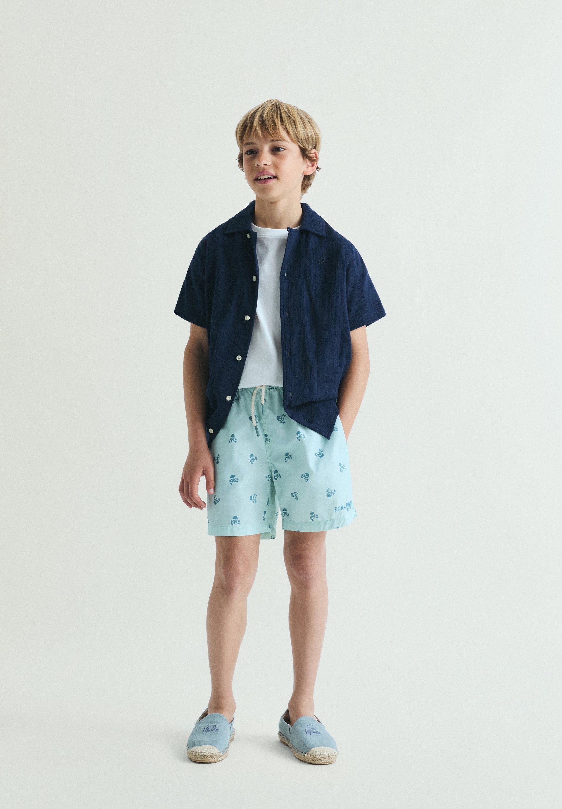 CONTRAST SKULL SWIMMING TRUNKS