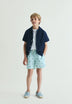 CONTRAST SKULL SWIMMING TRUNKS