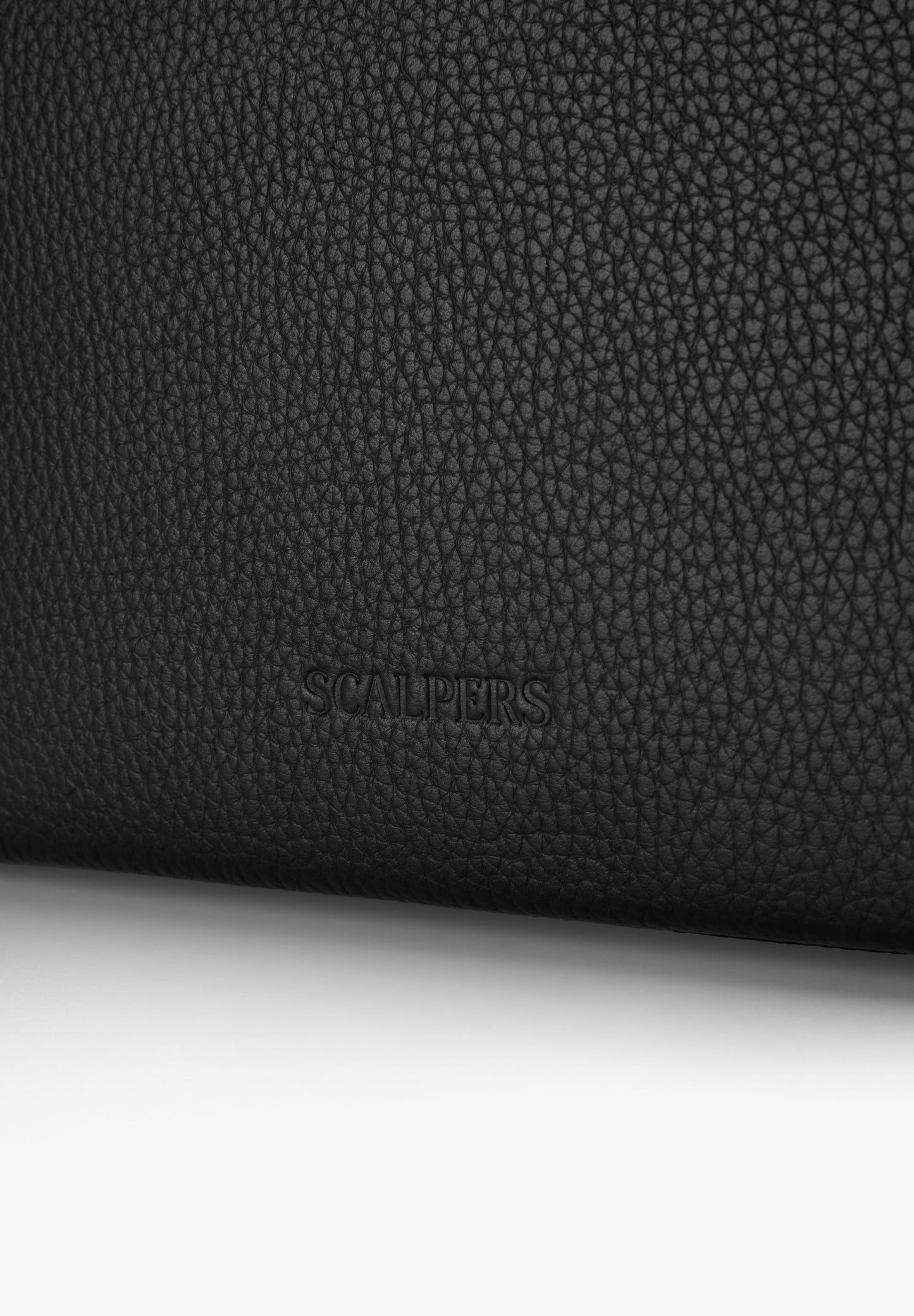 LEATHER BAG WITH APPLIQUÉS