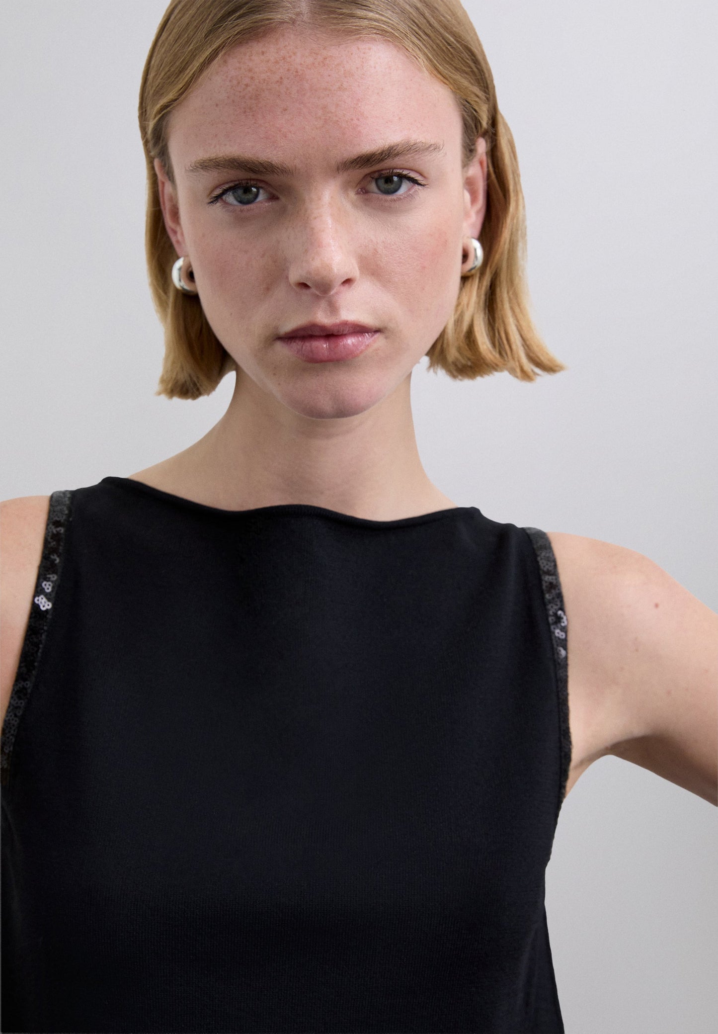 SEQUINNED TOP WITH WAVED HEM