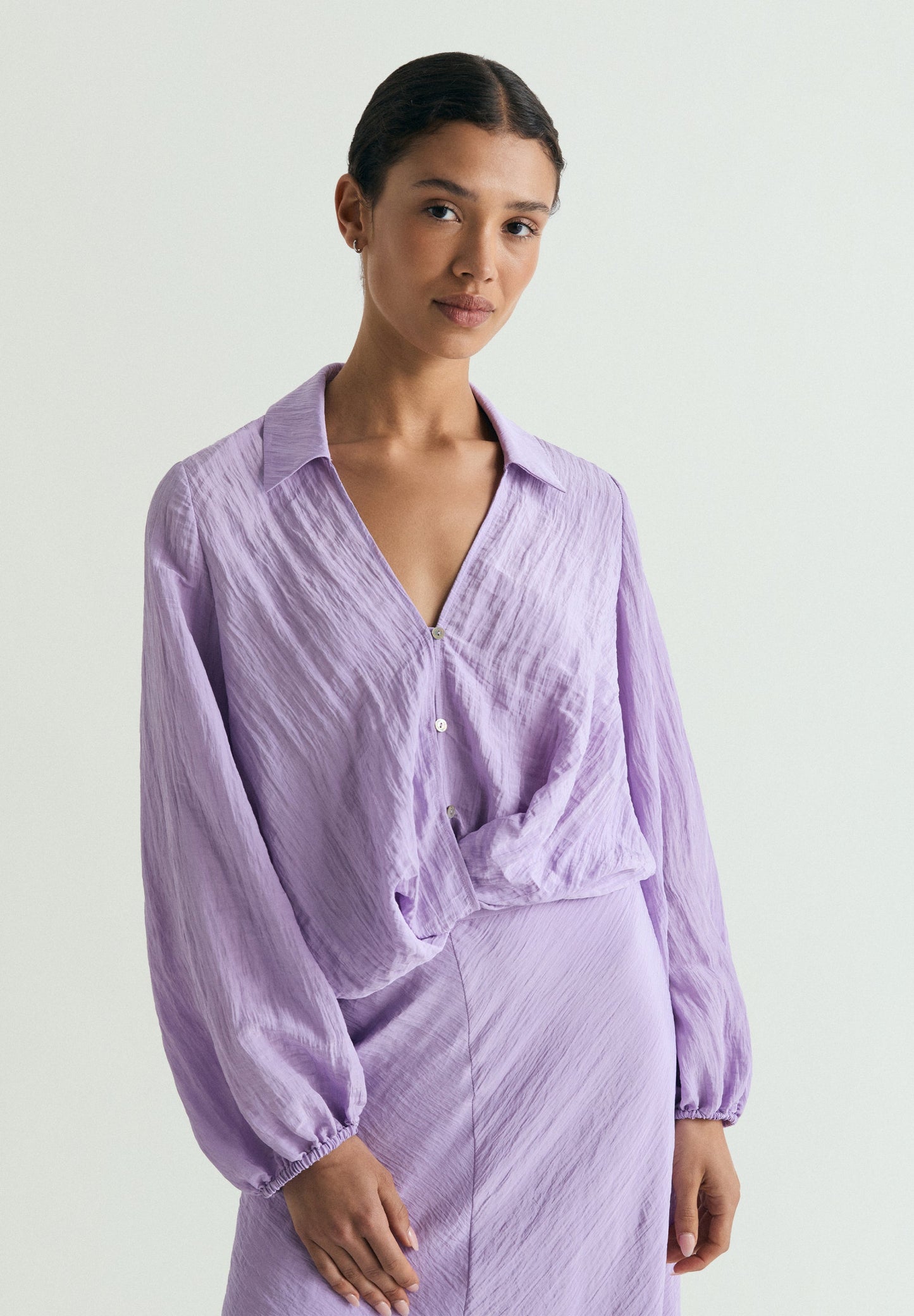 FLOWING BLOUSE WITH CRISS-CROS DETAIL