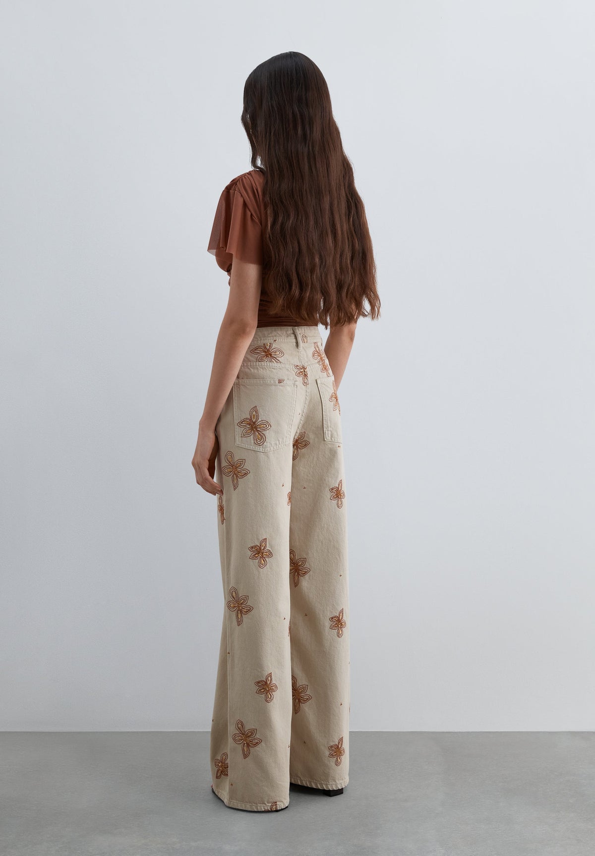 JEANS WITH FLORAL EMBROIDERY