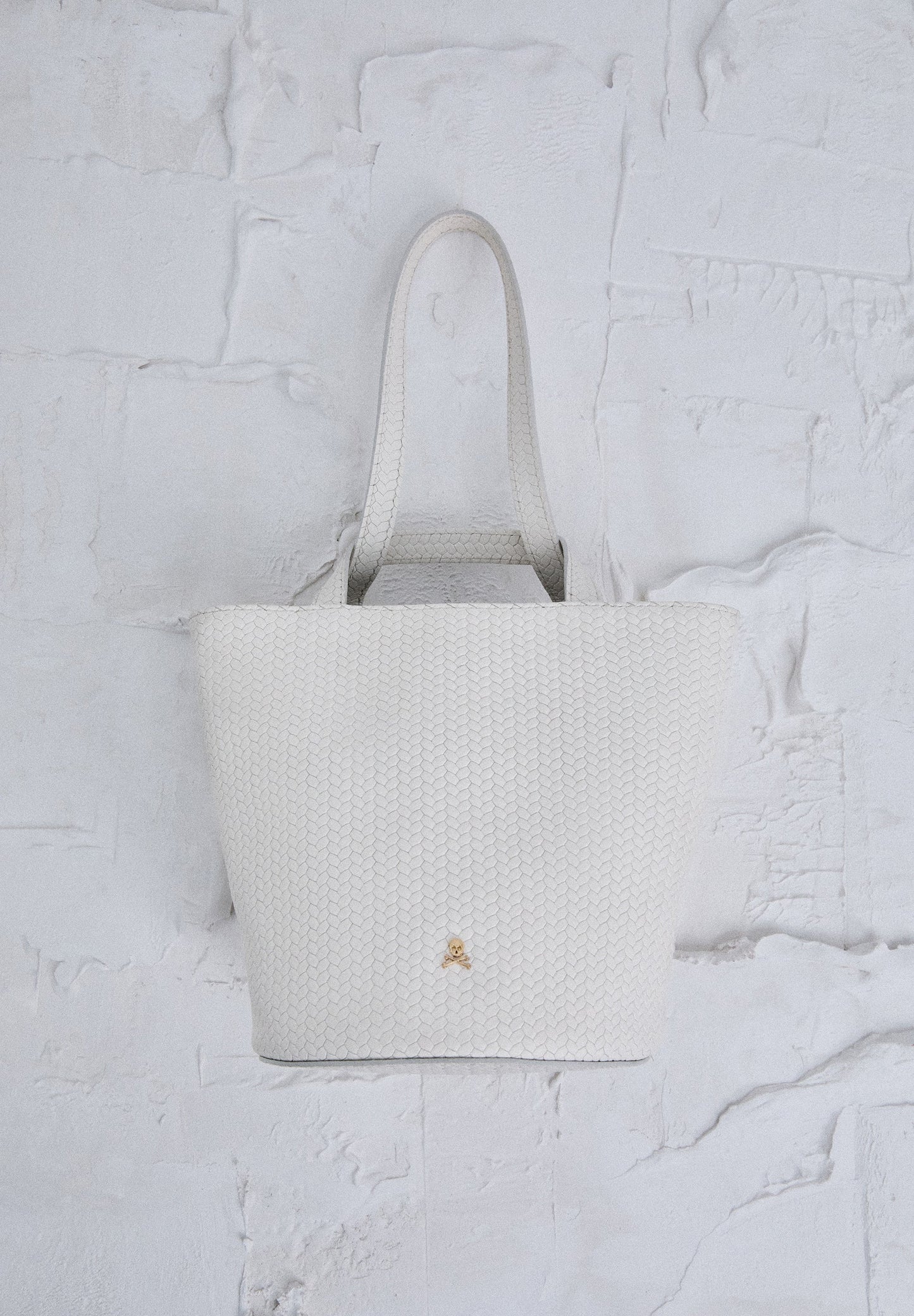 MINI BUCKET BAG IN 100% BRAIDED LEATHER