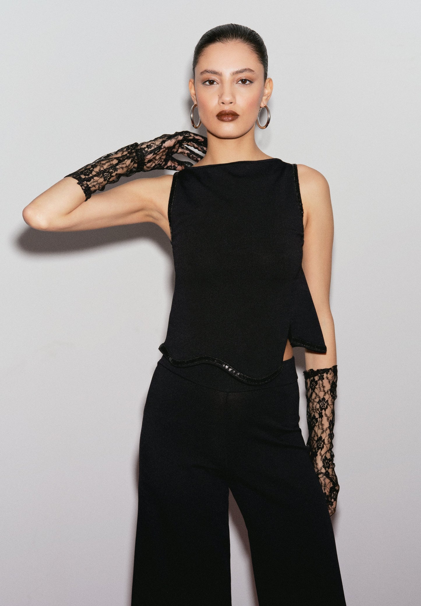 SEQUINNED TOP WITH WAVED HEM